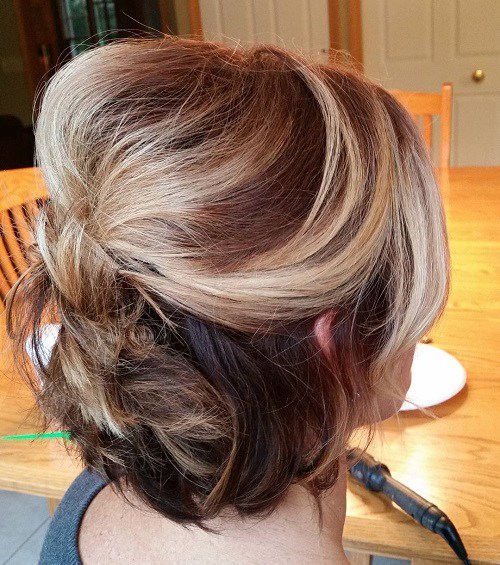 half updo with a bouffant for shorter hair