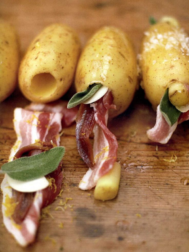Baked potatoes stuffed with bacon, anchovies and sage